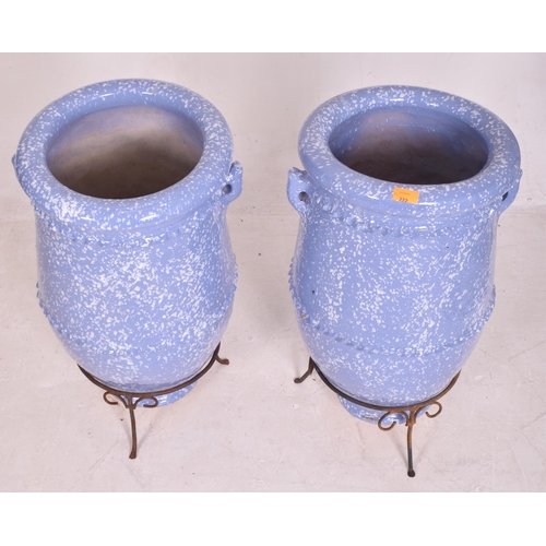 304 - A pair of large vintage blue glazed terracotta garden outdoor decorative amphora vases on stands. Ea... 