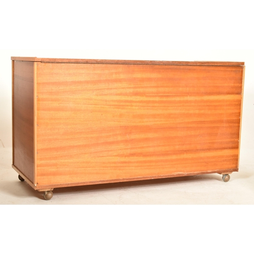 308 - A vintage mid century teak wood rectangular blanket chest / coffer raised on castors. The chest poss... 