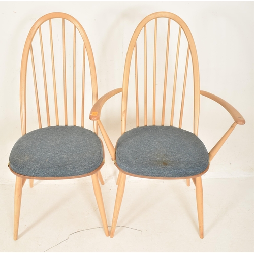 312 - Ercol Furniture - Quaker Range - a set of four beech & elm spindle hoop back dining chairs. Each... 