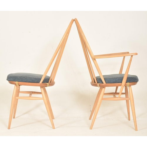 312 - Ercol Furniture - Quaker Range - a set of four beech & elm spindle hoop back dining chairs. Each... 