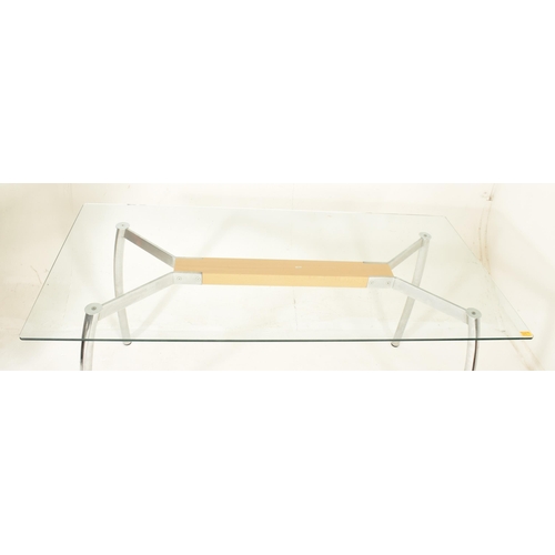 313 - A high end design contemporary chrome & glass conservatory patio dining table. The table having ... 