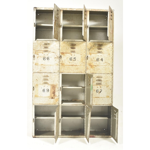 33 - A retro 20th century industrial / school metal locker cabinet of upright form. The cabinet comprisin... 