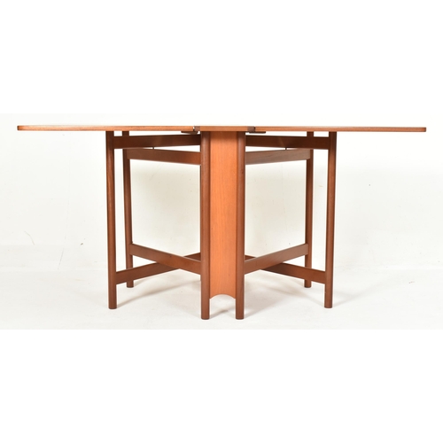 337 - Mackintosh Furniture - a vintage mid century solid teak wood dining table with drop leaf sides. The ... 