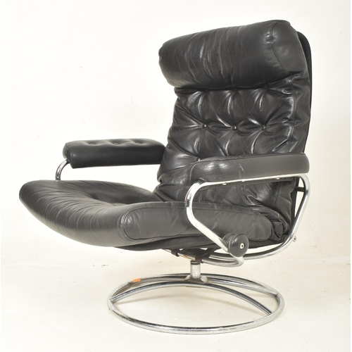 355 - Ekornes - a Swedish Modern Design 20th century 1970s chrome framed and black leather swivel lounge a... 