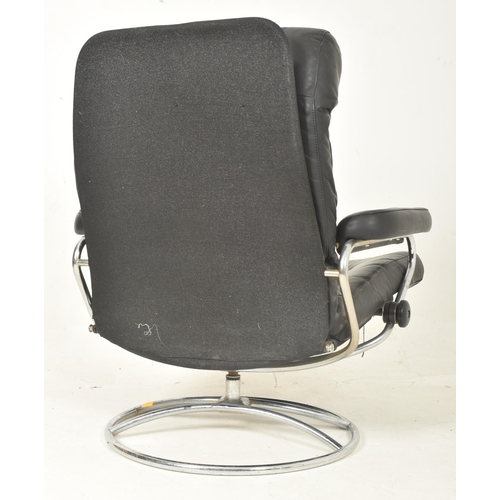 355 - Ekornes - a Swedish Modern Design 20th century 1970s chrome framed and black leather swivel lounge a... 