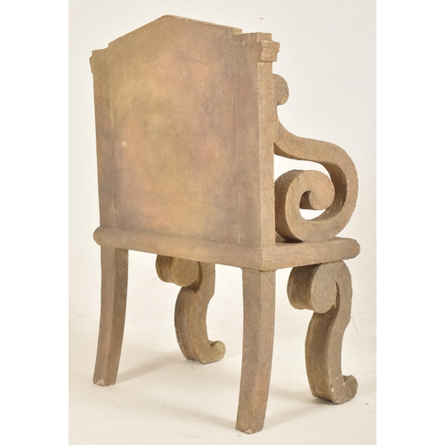 357 - A mixed cement & glue stone effect throne chair. The chair having a a crest shaped back rest with sc... 