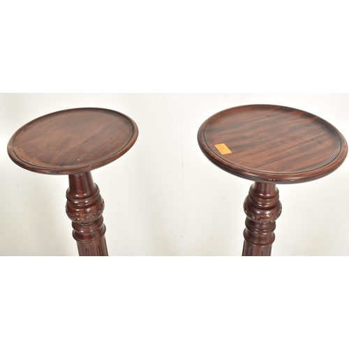 361 - A pair of contemporary high end design carved wood floor torchere column stands. Each jardiniere hav... 