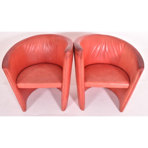 362 - British Modern Design - A pair of retro mid 20th century red leather tub lounge armchairs. Each chai... 