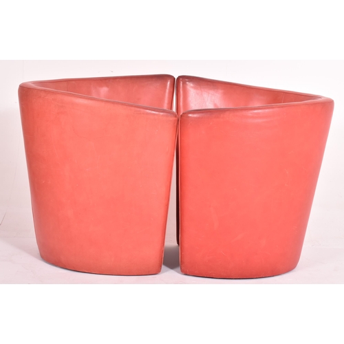 362 - British Modern Design - A pair of retro mid 20th century red leather tub lounge armchairs. Each chai... 