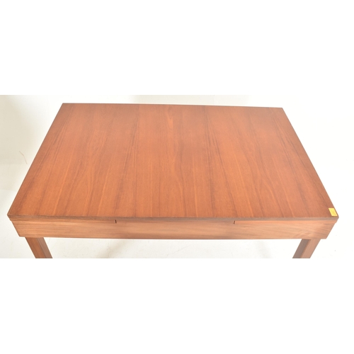 364 - Remploy, Britain - a retro mid 20th century teak dining table with four chairs. The table having a s... 