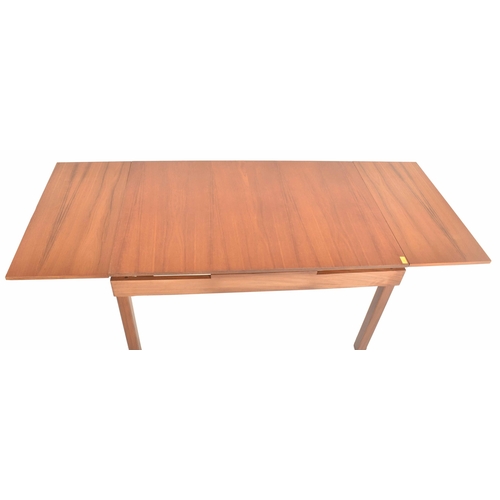 364 - Remploy, Britain - a retro mid 20th century teak dining table with four chairs. The table having a s... 