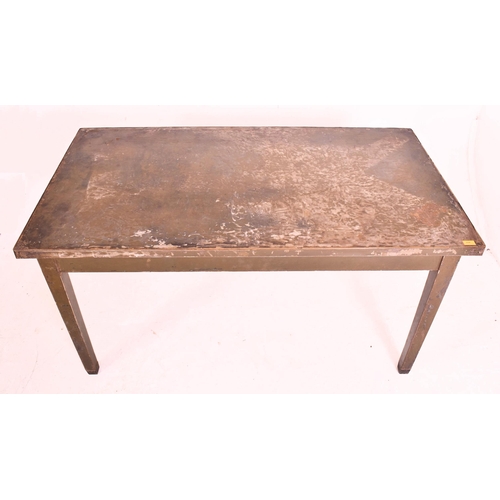 382 - A retro mid century industrial metal workman's table / desk. The table having a metal top and legs f... 