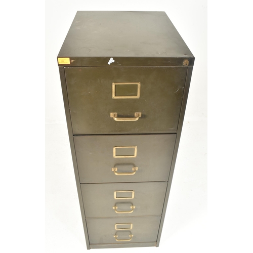 384 - A tall retro 20th century green metal industrial office filing cabinet. Rectangular top over a bank ... 