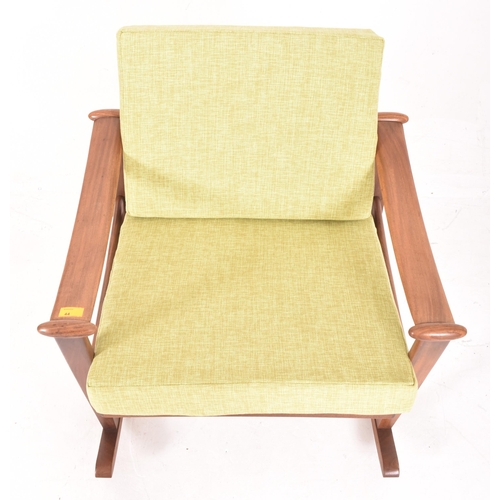 385 - A retro mid 20th century teak & hopsack style upholstered spade rocking armchair in the manner o... 