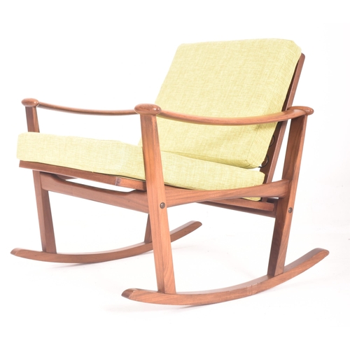 385 - A retro mid 20th century teak & hopsack style upholstered spade rocking armchair in the manner o... 