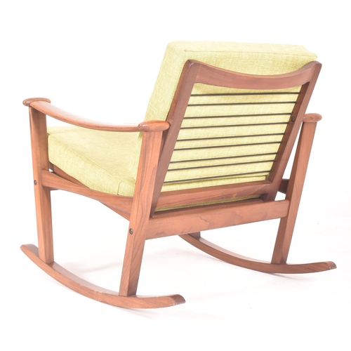 385 - A retro mid 20th century teak & hopsack style upholstered spade rocking armchair in the manner o... 