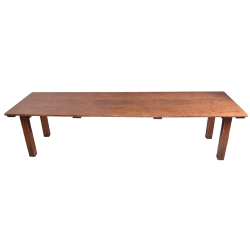 388 - A large 20th century oak refectory kitchen dining table. The table having an elongated rectangular t... 