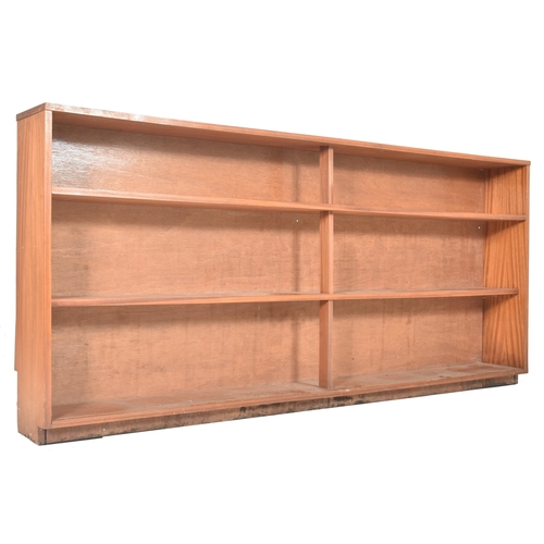 393 - A large British Modern Design retro 20th century teak wood & glass cabinet bookcase. The bookcas... 