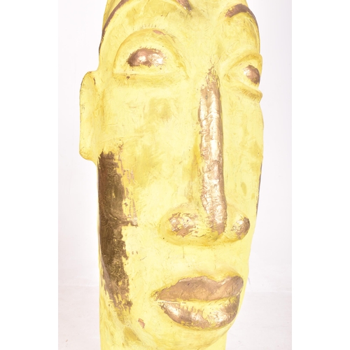 396 - A large bespoke made painted plaster floor standing decorative tribal inspired sculpture. The statue... 