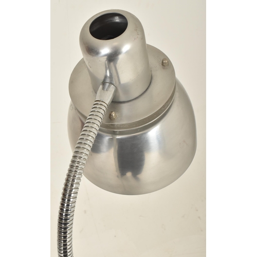 401 - Bell ID - a 20th century chrome floor standing lamp light. The lamp having an aluminium shade suppor... 