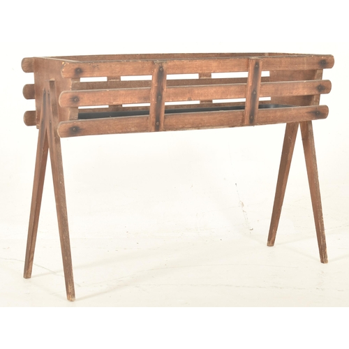 403 - A vintage mid 20th century teak planter / plant stand. The planter having a rectangular slatted top ... 