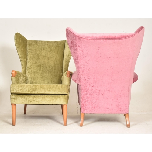 425 - Parker Knoll - Model 757 - a pair of retro 1960s wingback armchairs. Each chair having tall wingback... 