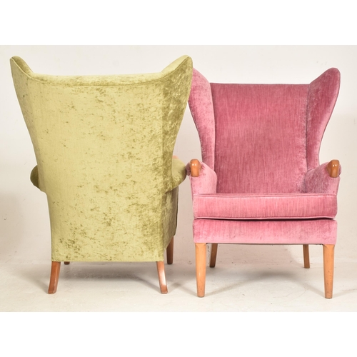 425 - Parker Knoll - Model 757 - a pair of retro 1960s wingback armchairs. Each chair having tall wingback... 