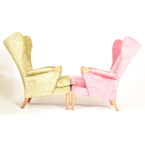 425 - Parker Knoll - Model 757 - a pair of retro 1960s wingback armchairs. Each chair having tall wingback... 