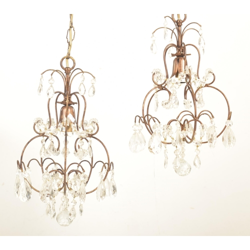 427 - Liberty of London - a pair of vintage 1990s toleware chandeliers. Each chandelier with curved suppor... 