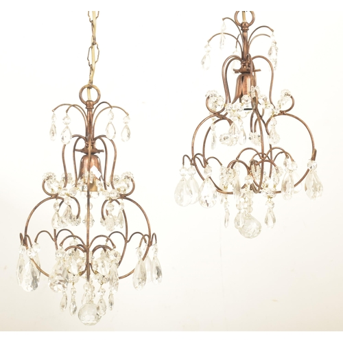 427 - Liberty of London - a pair of vintage 1990s toleware chandeliers. Each chandelier with curved suppor... 