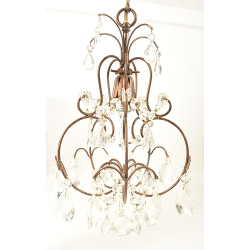 427 - Liberty of London - a pair of vintage 1990s toleware chandeliers. Each chandelier with curved suppor... 