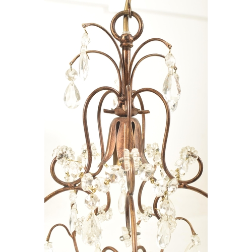 427 - Liberty of London - a pair of vintage 1990s toleware chandeliers. Each chandelier with curved suppor... 