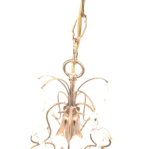 427 - Liberty of London - a pair of vintage 1990s toleware chandeliers. Each chandelier with curved suppor... 