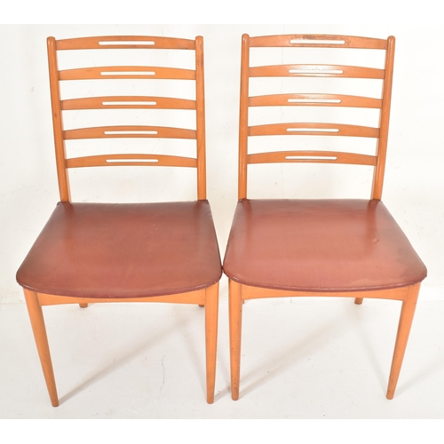 432 - A set of four retro mid 20th century Danish inspired teak framed dining chairs in the manner of Neil... 