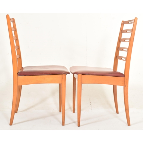 432 - A set of four retro mid 20th century Danish inspired teak framed dining chairs in the manner of Neil... 