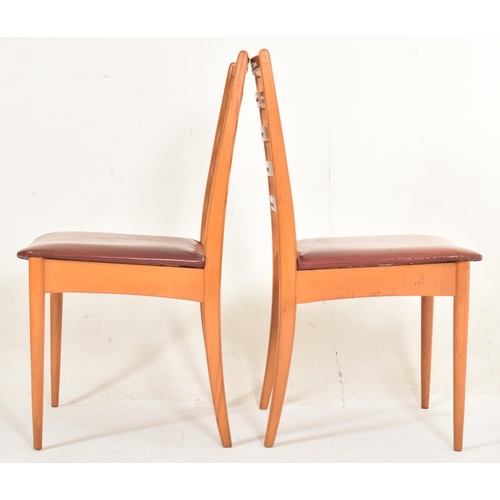 432 - A set of four retro mid 20th century Danish inspired teak framed dining chairs in the manner of Neil... 