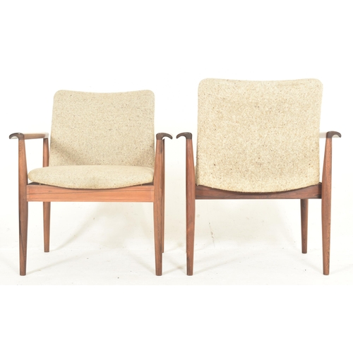 45 - Finn Juhl for France & Son - Diplomat chair - a pair of mid 20th century Danish designer teak armcha... 