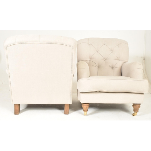 460 - A matching pair of high-end British modern design armchairs. Each chair having button-backed backres... 