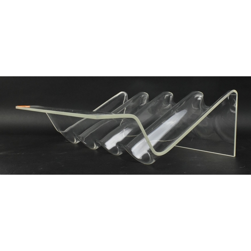 463 - A retro 20th century 1970s moulded acrylic wine rack. Four moulded sections for holding wine or spir... 