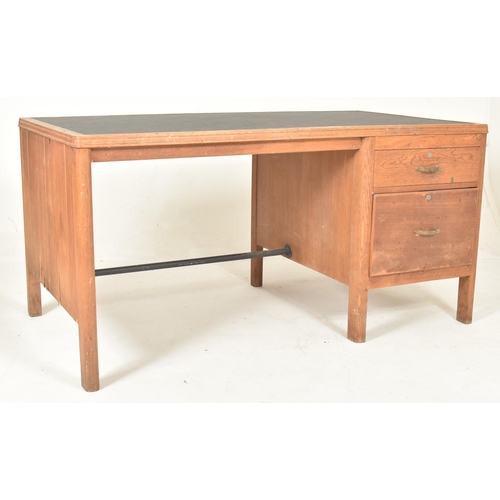 481 - A retro 20th century pine wood & leather top office writing desk tbale. The desk having a rectan... 