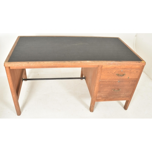 481 - A retro 20th century pine wood & leather top office writing desk tbale. The desk having a rectan... 