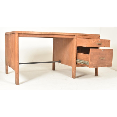 481 - A retro 20th century pine wood & leather top office writing desk tbale. The desk having a rectan... 