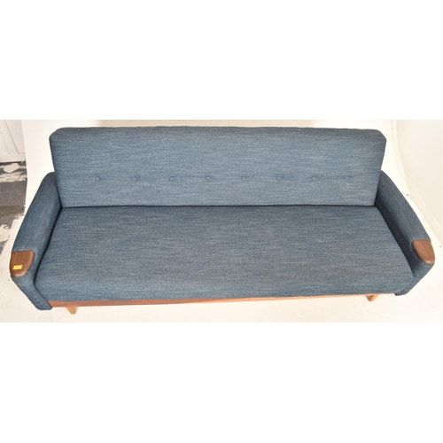 485 - A retro 20th century Danish daybed / sofa settee. The sofa having buttoned back backrest with uphols... 