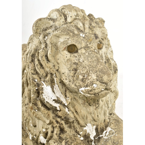 488 - A retro 20th century composite stone with beaded eyes garden outdoor decorative lion sculpture. The ... 