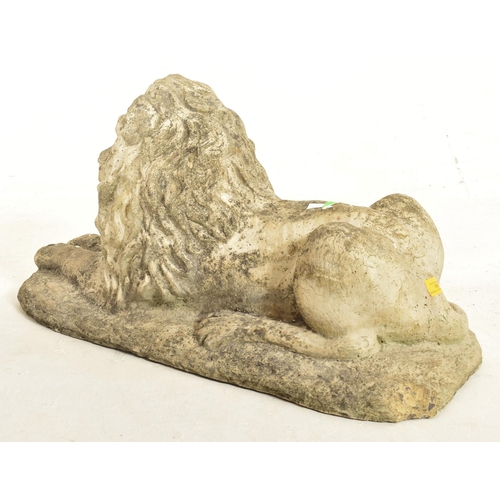 488 - A retro 20th century composite stone with beaded eyes garden outdoor decorative lion sculpture. The ... 