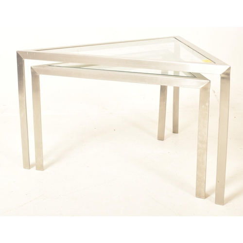 489 - A retro 20th century Italian manner glass & chrome nest of two triangular tables. Each having a ... 