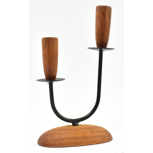 49 - A retro 20th century Danish design candlestick holder. The candlestick having two turned teak holder... 