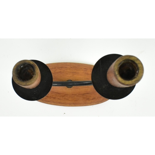 49 - A retro 20th century Danish design candlestick holder. The candlestick having two turned teak holder... 