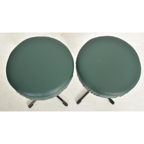 494 - A pair of retro 20th century leatherette upholstered & black metal swivel office / desk stools s... 