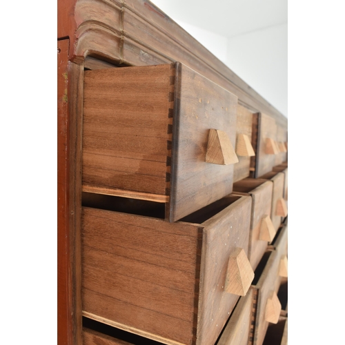 50 - A large retro 20th century oak & pine haberdashery / apothecary storage standing 100 drawers cup... 